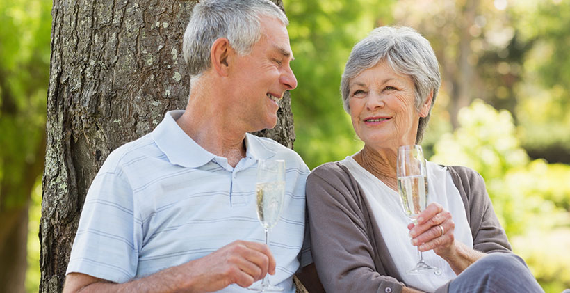 senior couple drinking champagne